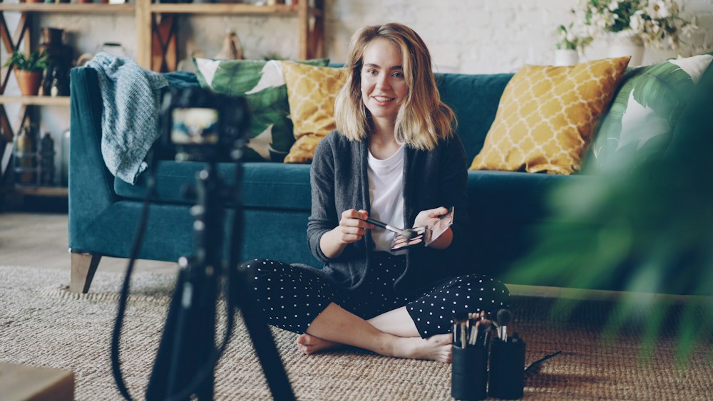 Creator recording a skincare video in her home studio